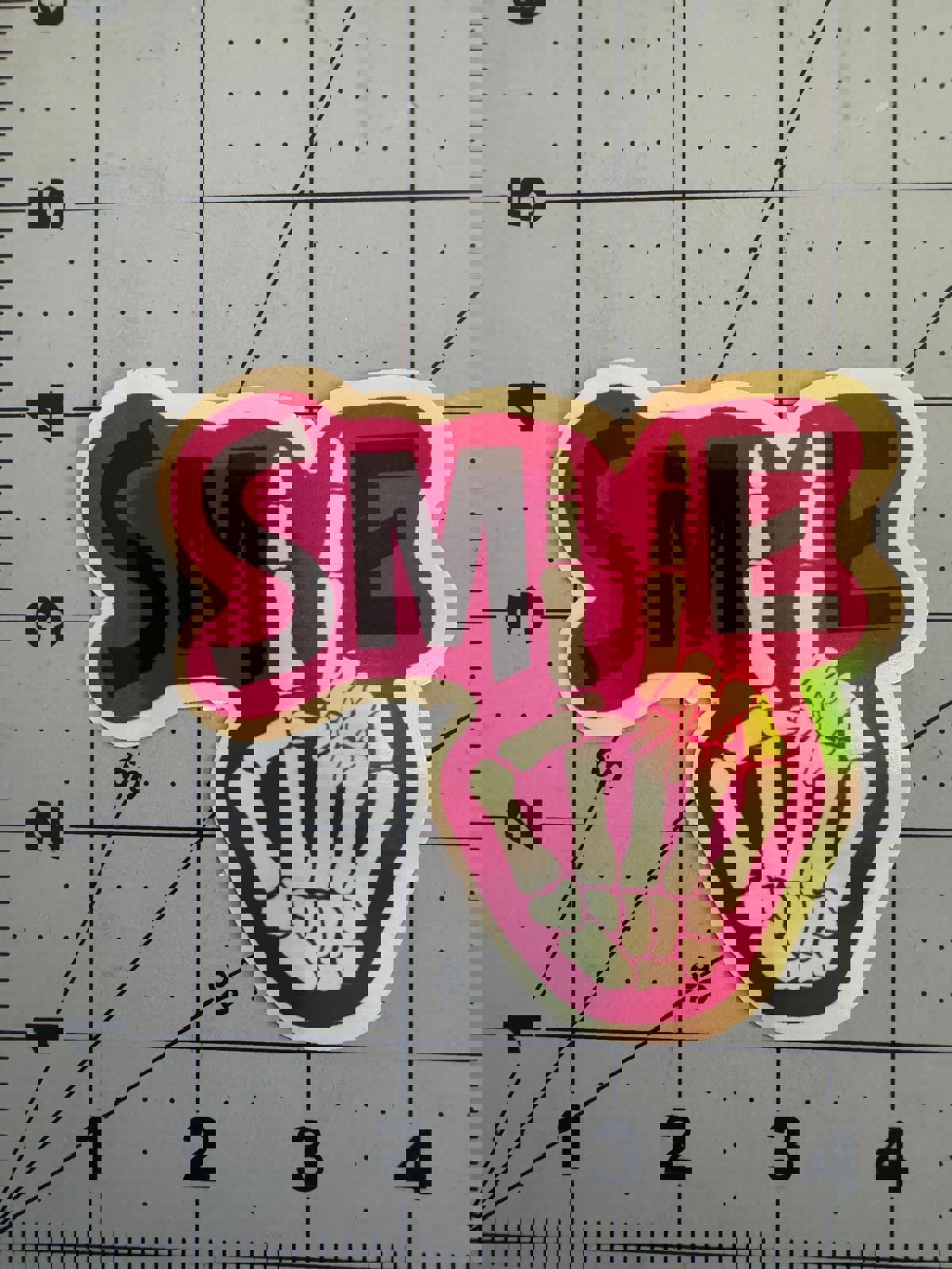 “Smile” Skeleton Peace Sign Sticker – Holographic Positivity with a Bony Twist