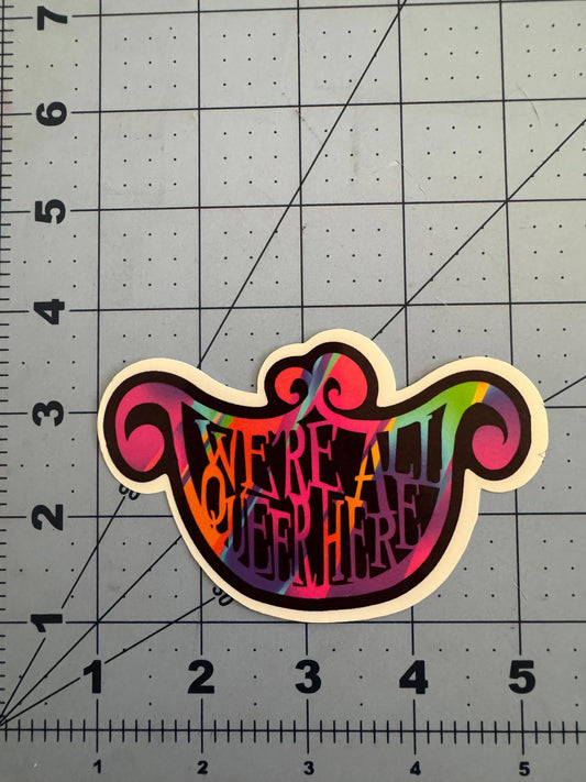 “We’re All Queer Here” Rainbow Cheshire Cat Smile Sticker – Holographic and Classic White Options