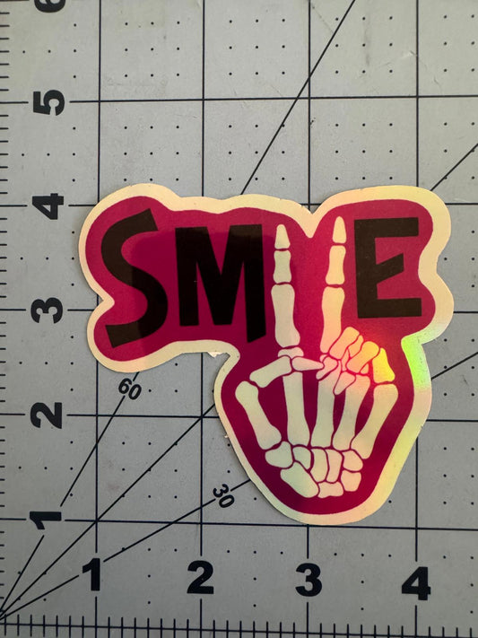 “Smile” Skeleton Peace Sign Sticker – Holographic Positivity with a Bony Twist
